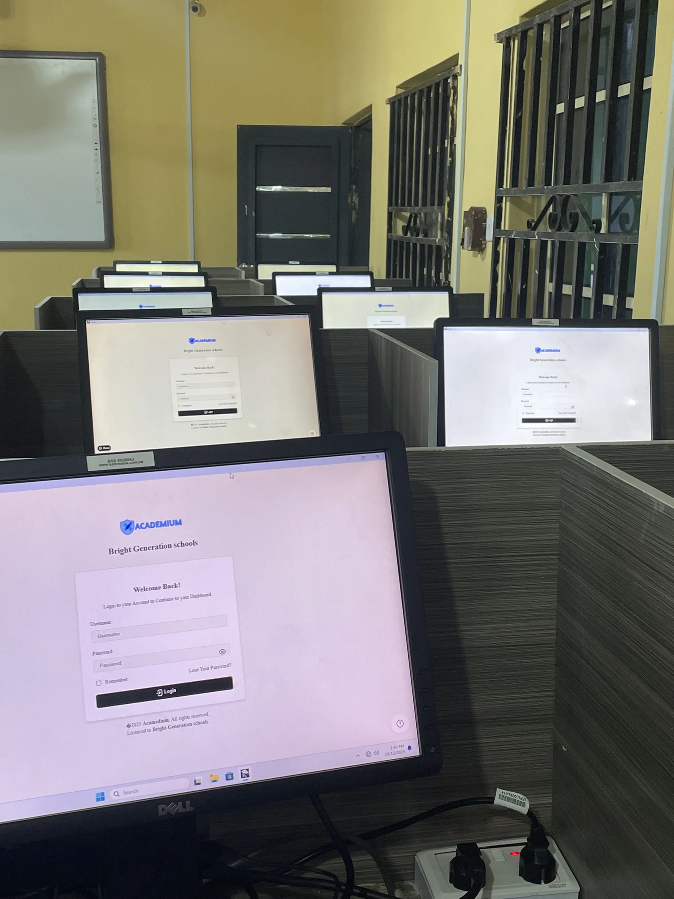 Rows of school laboratory computers connected to Academium.